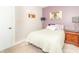 Bedroom features a bed with plush bedding, decorative pillows, and bedside table at 8925 Sunburst Cir, Indianapolis, IN 46227