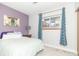 Bedroom features a plush bed, ample natural light, and tasteful décor at 8925 Sunburst Cir, Indianapolis, IN 46227