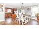Open kitchen and dining area with wood cabinets and stainless steel appliances at 8925 Sunburst Cir, Indianapolis, IN 46227