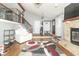 Inviting living room with soaring ceilings, hardwood floors, a fireplace and staircase to the second level at 8925 Sunburst Cir, Indianapolis, IN 46227