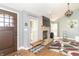 Cozy living room with stone fireplace, vaulted ceilings, hardwood floors, windows and comfortable furniture at 8925 Sunburst Cir, Indianapolis, IN 46227