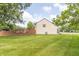 Home with lawn and side yard showing deck and fence at 8925 Sunburst Cir, Indianapolis, IN 46227