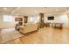 Finished basement with a cozy seating area, brick accents, and a game table, creating a versatile living space at 9237 Rocky Cay Ct, Zionsville, IN 46077