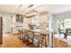 Bright kitchen featuring a large island with seating, stainless steel appliances, and access to the breakfast nook at 9237 Rocky Cay Ct, Zionsville, IN 46077