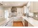 Bright kitchen with custom cabinetry, stainless steel appliances, and stylish backsplash, perfect for cooking and entertaining at 9237 Rocky Cay Ct, Zionsville, IN 46077
