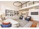 Spacious living room with built-in shelving, comfortable seating, and abundant natural light at 9237 Rocky Cay Ct, Zionsville, IN 46077