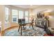 Stylish home office with a glass-top desk, charming decor, and plenty of natural light, ideal for productivity at 9237 Rocky Cay Ct, Zionsville, IN 46077