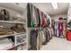 Spacious walk-in closet featuring built-in shelving and ample storage for clothing and accessories at 9237 Rocky Cay Ct, Zionsville, IN 46077