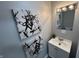 Cozy bathroom with sleek vanity, mirror, and modern abstract decor at 937 N Routiers Ave, Indianapolis, IN 46219