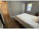 A large bedroom with an adjacent bathroom featuring modern marble tile at 937 N Routiers Ave, Indianapolis, IN 46219