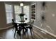Sunlit dining room with a modern table, stylish light fixture, and ample natural light at 937 N Routiers Ave, Indianapolis, IN 46219