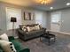 Comfortable living room filled with natural light, modern decor, and hardwood flooring at 937 N Routiers Ave, Indianapolis, IN 46219