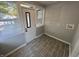 A view of the mud room with tile floors, many windows and a door to the outside at 937 N Routiers Ave, Indianapolis, IN 46219