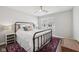 Bedroom with ceiling fan, stylish rug, and a view of the neighborhood at 9707 Prairie Smoke Dr, Noblesville, IN 46060