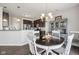 The dining area showcases a charming hutch, round table and is open to the kitchen at 9707 Prairie Smoke Dr, Noblesville, IN 46060