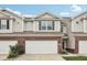 Charming townhome with brick accents, two-car garage, and well-maintained landscaping for curb appeal at 9707 Prairie Smoke Dr, Noblesville, IN 46060