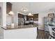 Charming kitchen with stainless steel appliances, granite counter tops, and opens to dining area at 9707 Prairie Smoke Dr, Noblesville, IN 46060