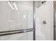 Modern glass-enclosed shower with sleek fixtures and a built-in seat at 9707 Prairie Smoke Dr, Noblesville, IN 46060