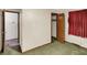 A bedroom with a window, closet, and doorway leading to another room at 10159 Hodge Rd, Clayton, IN 46118