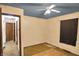 Simple bedroom with a ceiling fan, a window and doorway entrances to other rooms at 10159 Hodge Rd, Clayton, IN 46118