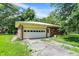 A rear exterior view of a brick home with an attached garage at 10159 Hodge Rd, Clayton, IN 46118