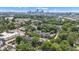 An aerial view of the neighborhood shows houses with green trees and a skyline in the distance at 1105 Windsor St, Indianapolis, IN 46201