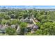 This is an aerial view of a neighborhood with green trees and a skyline in the distance at 1105 Windsor St, Indianapolis, IN 46201