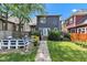 Private backyard with a patio, deck, lush greenery, and outdoor seating at 1105 Windsor St, Indianapolis, IN 46201