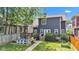 Charming backyard featuring a stone patio with a conversation set and a lush lawn at 1105 Windsor St, Indianapolis, IN 46201