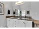 Bathroom featuring double sink vanity with granite countertop and modern fixtures at 1105 Windsor St, Indianapolis, IN 46201