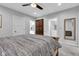 Bedroom showcasing carpet floors, a ceiling fan, and an ensuite bathroom at 1105 Windsor St, Indianapolis, IN 46201