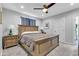 A primary bedroom featuring carpet floors, wood furniture, and natural light at 1105 Windsor St, Indianapolis, IN 46201