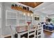 Light-filled dining area showcases a decorative wood ceiling and views of the living room at 1105 Windsor St, Indianapolis, IN 46201