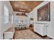 Dining area featuring decorative wood ceiling, stylish decor, and seamlessly flows into living spaces at 1105 Windsor St, Indianapolis, IN 46201