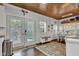 The back of the home has a dining room with stylish decor and French doors leading to backyard at 1105 Windsor St, Indianapolis, IN 46201
