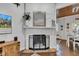 Bright fireplace with stone mantle, decorative mirror, and adjacent dining space with wood ceiling at 1105 Windsor St, Indianapolis, IN 46201