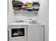 A well-organized laundry room showcasing a washer, dryer, and shelving for storage at 1105 Windsor St, Indianapolis, IN 46201