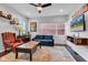 Bright living room with a ceiling fan, and cozy furniture including a sofa and leather armchair at 1105 Windsor St, Indianapolis, IN 46201