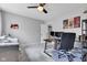 Bright office space featuring a wooden desk, office chair, and a cozy sofa at 1105 Windsor St, Indianapolis, IN 46201