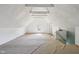 Large attic area with white walls and ceiling, wood beams, carpeted floor at 1129 Trowbridge St, Indianapolis, IN 46203