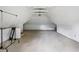 Large attic area with white walls and ceiling, wood beams, carpeted floor at 1129 Trowbridge St, Indianapolis, IN 46203