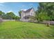 Large backyard with a well-maintained lawn and a fence at 1129 Trowbridge St, Indianapolis, IN 46203