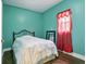 Bright bedroom showcasing wood flooring and natural light, creating a relaxing atmosphere at 1129 Trowbridge St, Indianapolis, IN 46203