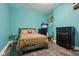 Comfortable bedroom featuring two dressers, wood floors, and natural light at 1129 Trowbridge St, Indianapolis, IN 46203