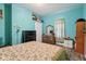 Cozy bedroom features wood floors, natural lighting, and ample storage space at 1129 Trowbridge St, Indianapolis, IN 46203