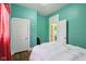 Bright bedroom with white trim, wood floors, and white comforter at 1129 Trowbridge St, Indianapolis, IN 46203