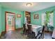 Inviting dining room with a large window, hardwood floors, and classic decor at 1129 Trowbridge St, Indianapolis, IN 46203