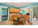 Bright kitchen boasting tile flooring, wood cabinets, and a convenient kitchen breakfast nook at 1129 Trowbridge St, Indianapolis, IN 46203