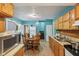 Efficient kitchen featuring tile floors, wooden cabinets, and stainless steel sink at 1129 Trowbridge St, Indianapolis, IN 46203