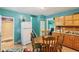Inviting kitchen with tile flooring, wood cabinets, and a breakfast nook seating four at 1129 Trowbridge St, Indianapolis, IN 46203